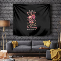 Black wall tapestry featuring floral skull portrait with pink and white lettering