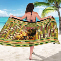 African sarong draped over shoulders with kente pattern and central lion print in green
