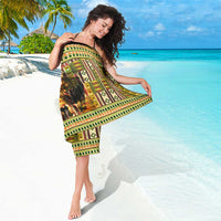 African sarong swirled wrap with kente motifs and lion print, green and gold borders