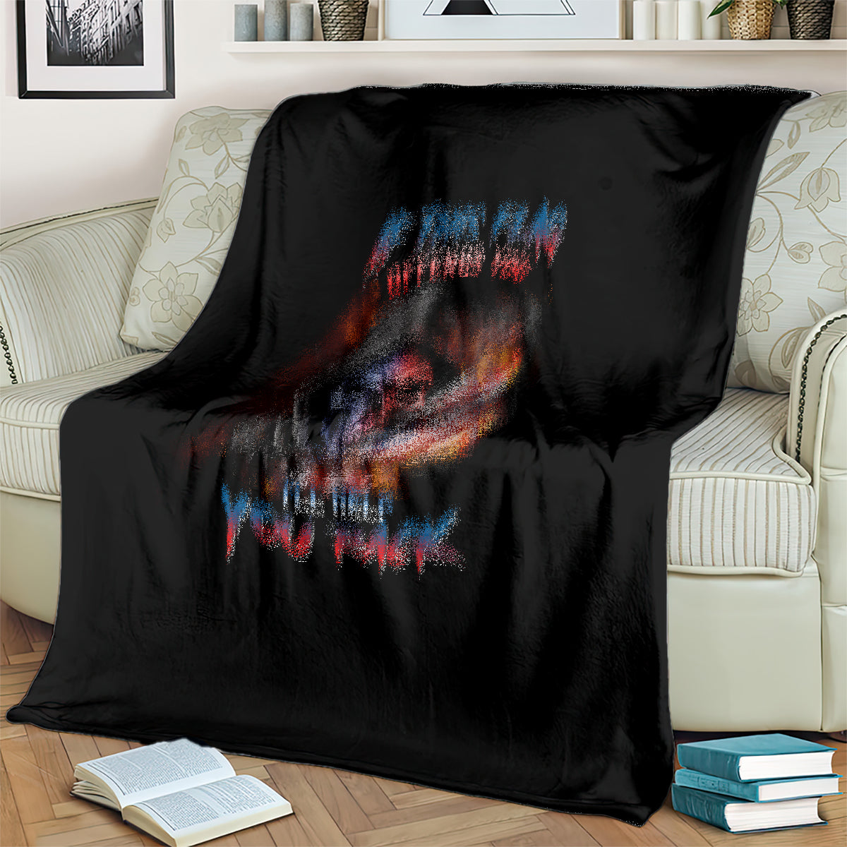 Black skull graphic blanket with fiery flag design and multicolor slogan text