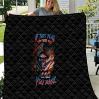 Black quilt featuring diamond quilting and centered fiery skull face artwork