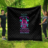 Black quilt with diamond stitching and colorful skull graphic centered on the face