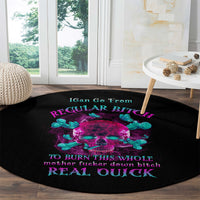 Black round carpet with neon skull graphic and multicolor text, full circular view