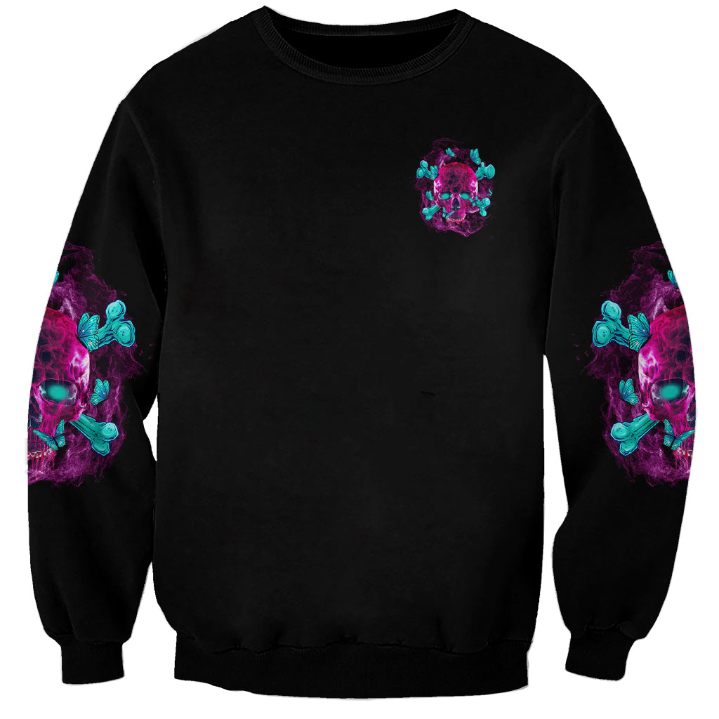 Black unisex sweatshirt with small multicolor skull graphic on front