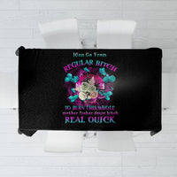 Black tablecloth with colorful central graphic print and neon text design