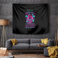 Black wall tapestry featuring a multicolor skull design and stacked text