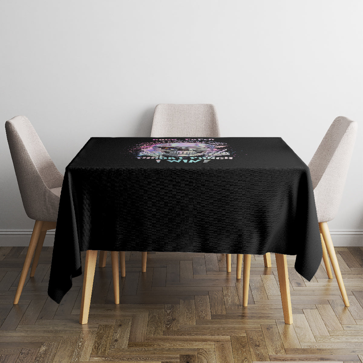 Black tablecloth on dining table with colorful skull artwork at center