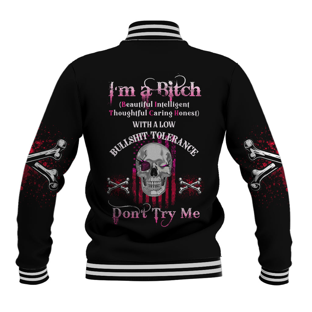 Black unisex baseball jacket, back print with skull, bats, and pink text; striped cuffs