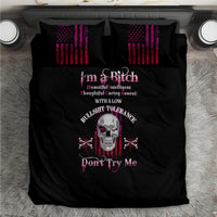 Black duvet bedding set with centered skull graphic and two striped accent pillows