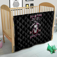 Black quilt with diamond quilting and skull graphic, 'Don't Try Me' on crib