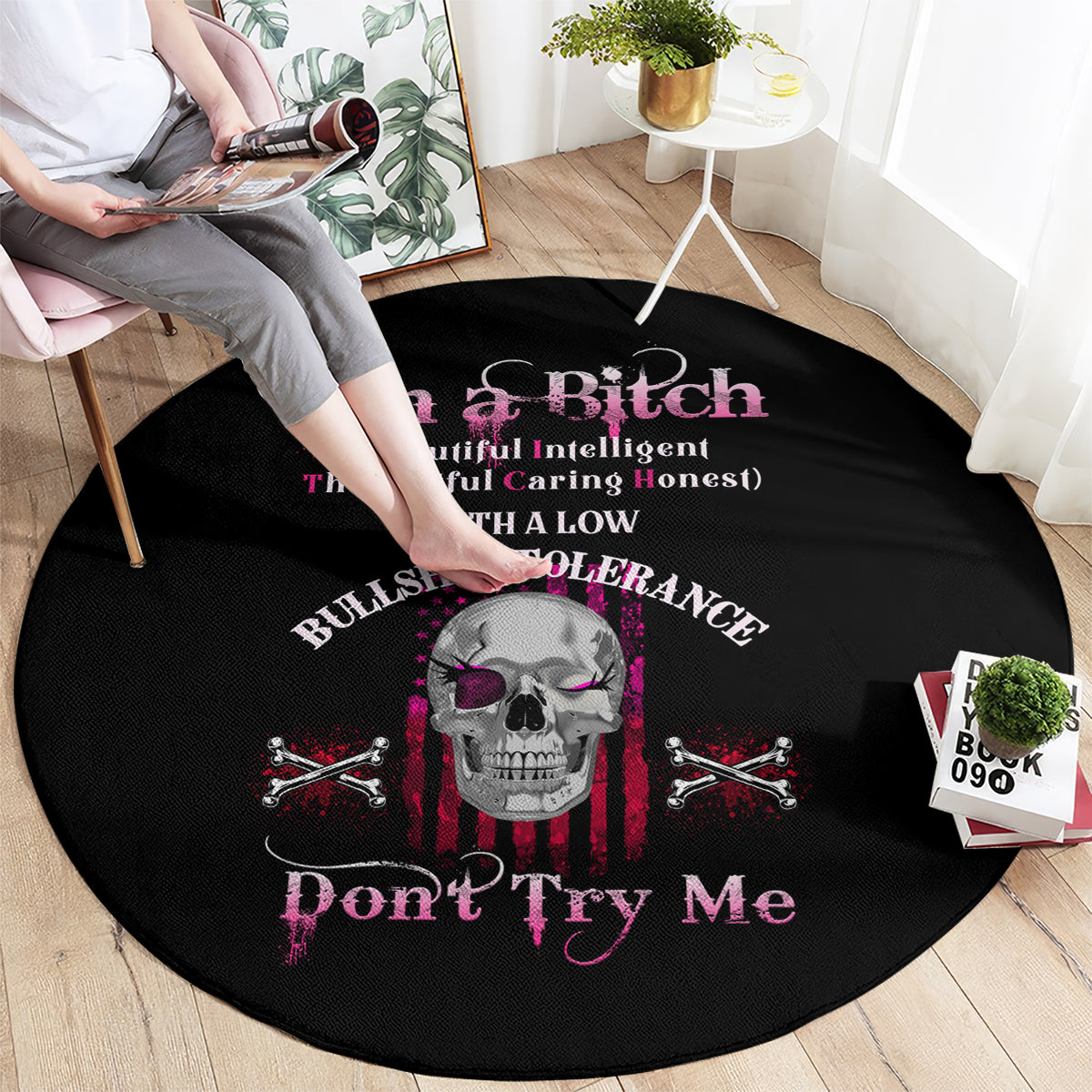 Round black graphic rug with skull and pink "Don't Try Me" text