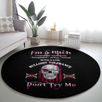 Round black graphic rug with skull, crossed guns, and pink "Don't Try Me" text