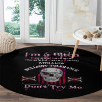Round black rug with skull design and pink "Don't Try Me" lettering