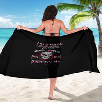 Black sarong with skull graphic and rebellious pink text print, wide drape