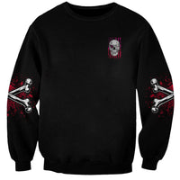 Unisex black sweatshirt with small skull graphic on chest and red/white sleeve prints