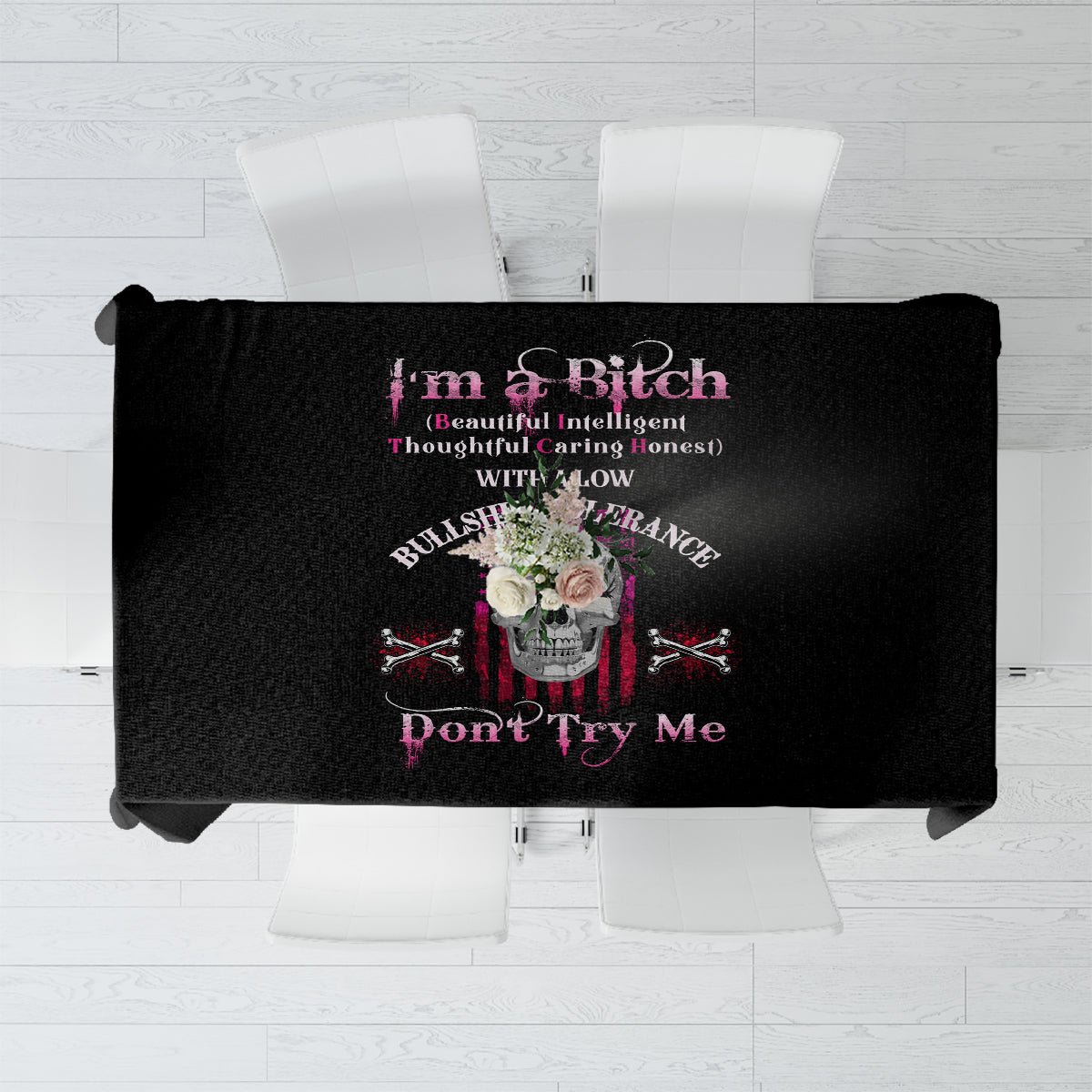 Black tablecloth with bold skull and rebel-style typography graphic, centered