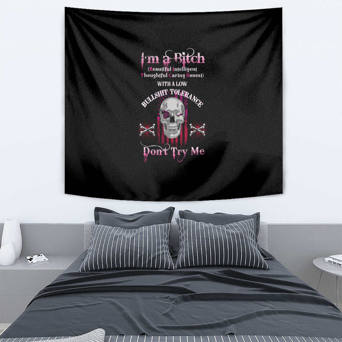 Black tapestry wall hanging with colorful skull and text graphic