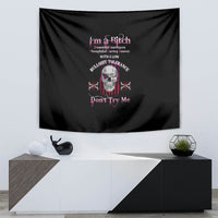 Black tapestry wall hanging featuring skull design and colorful lettering