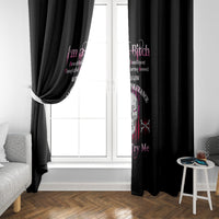 Black curtain panels with skull motif on both sides of a bright window