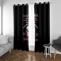 Black curtain pair with centered skull print, hung from a top rod with rings