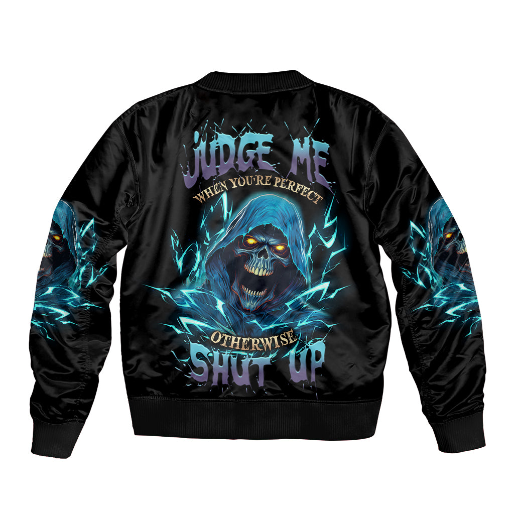 Black bomber jacket with blue skull-reaper graphic on back, ribbed cuffs and hem.