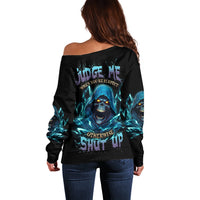 Off-shoulder black sweater with blue skull reaper graphic on back