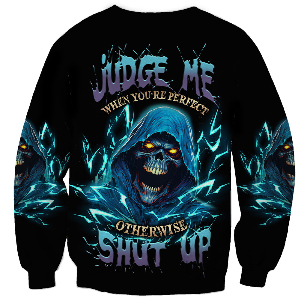 Black unisex sweatshirt with blue reaper skull graphic and glowing electric streaks