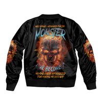 Black satin bomber jacket with large monster skull graphic on back, ribbed cuffs and hem.