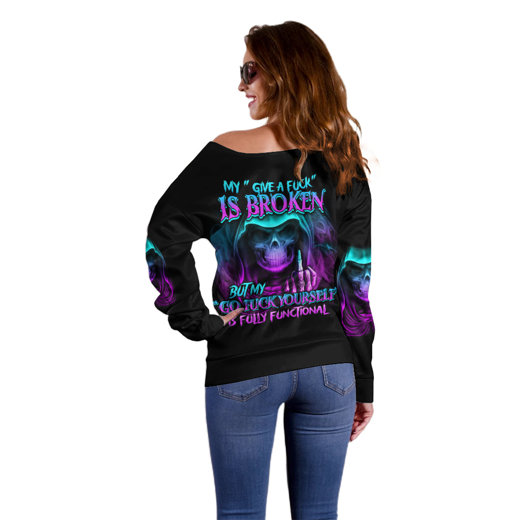 Off-shoulder black sweater, back view with purple-blue skull and flame graphics