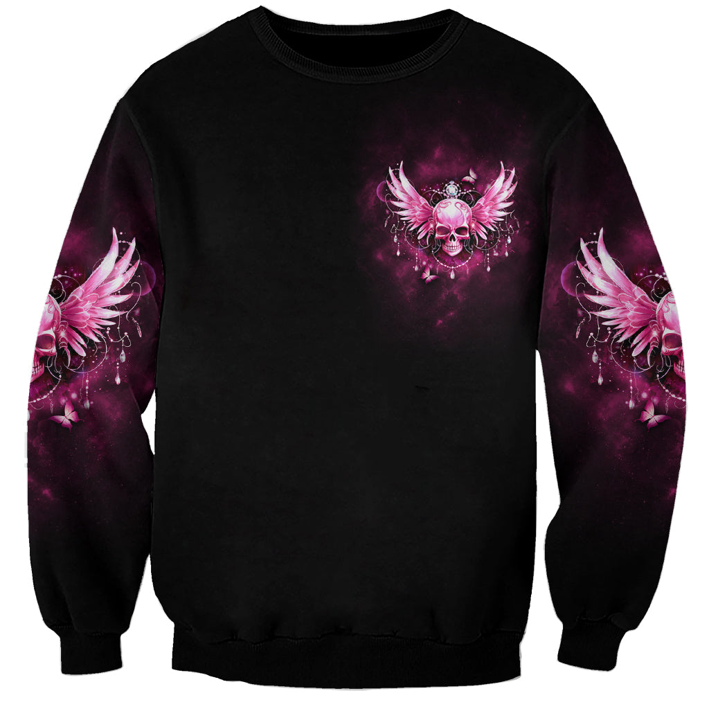 Unisex black sweatshirt with small purple skull and wing graphic on chest, crewneck
