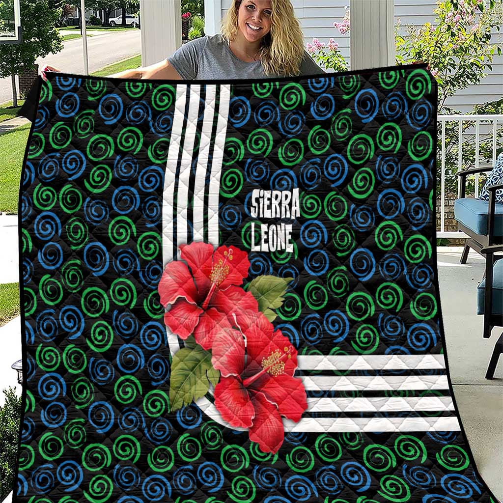 Sierra Leone Quilt with Red Hibiscus Floral Design and Tribal Swirl Pattern