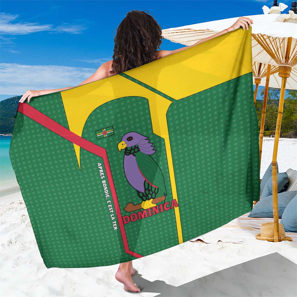 Green sarong with yellow trim, parrot and stars print with Dominica text and motto