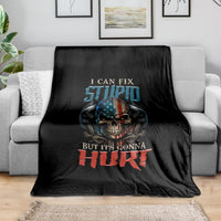 Black fleece blanket with skull graphic and bold "But it's gonna hurt" text