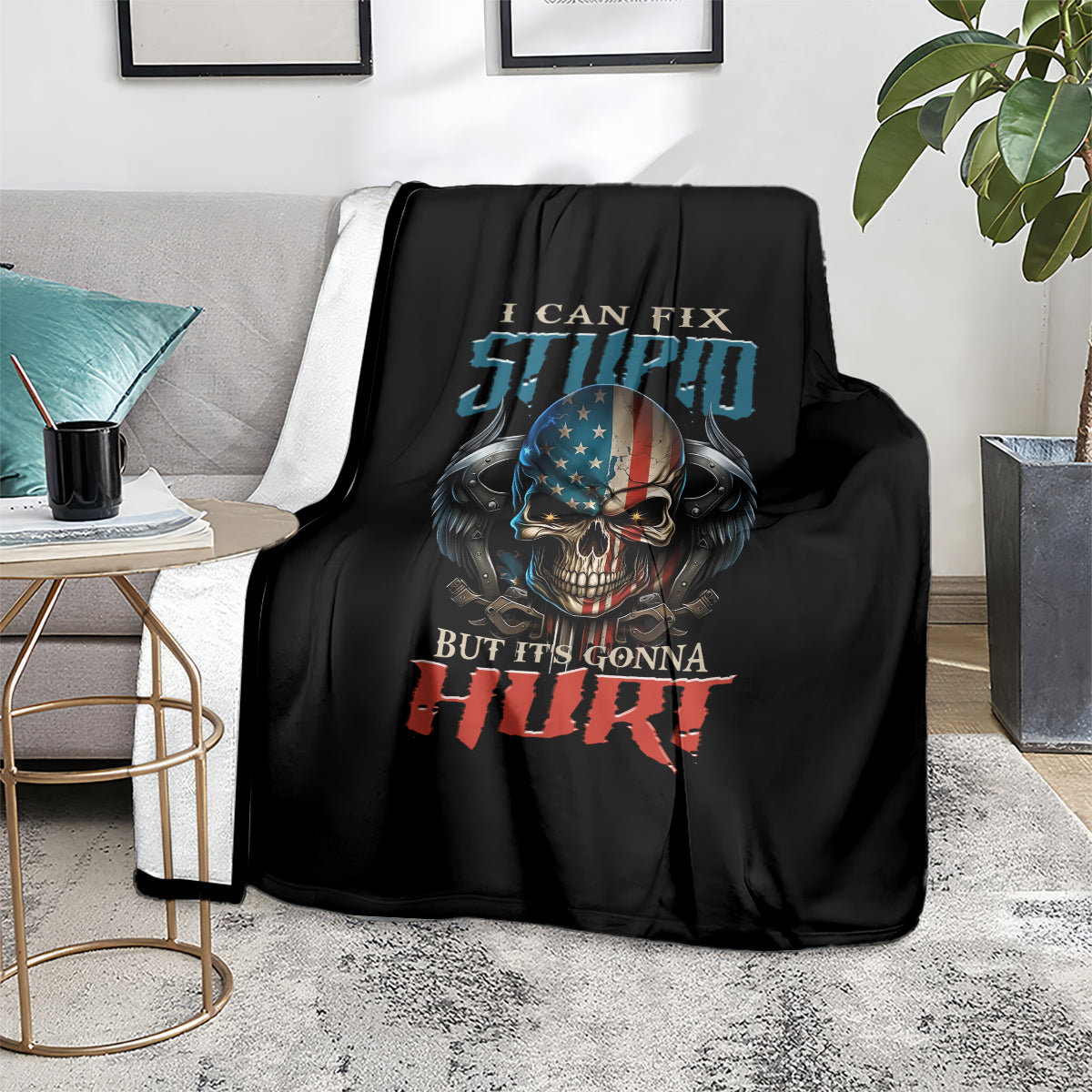 Black blanket featuring skull face graphic and "But it's gonna hurt" slogan
