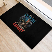 Black rubber doormat with skull graphic and bold red, blue, and white text design
