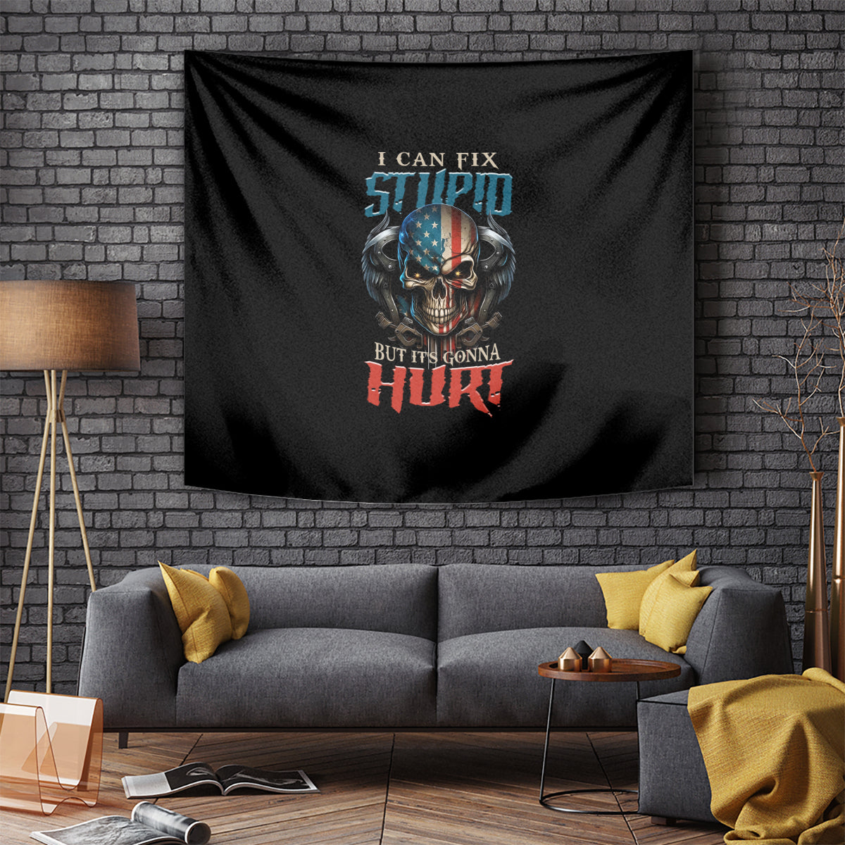 Black tapestry with colorful skull and slogan, mounted on a brick wall behind a sofa.