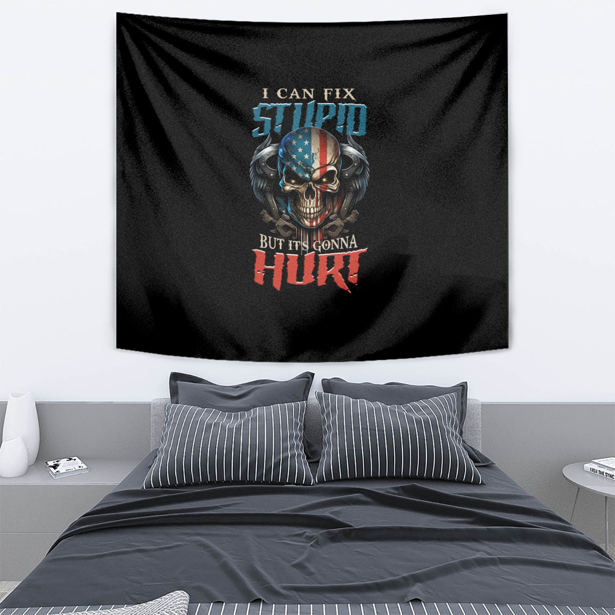 Black tapestry with colorful skull graphic and slogan, hung on a wall above bedding.