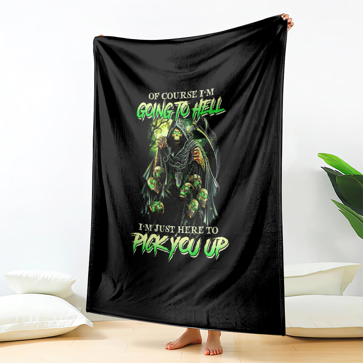 Black skull graphic throw blanket with neon green text, hung vertically