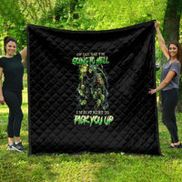 Black quilt blanket with diamond stitching and green skull graphic, text centered