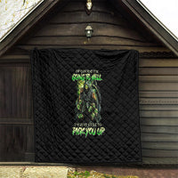 Black quilt blanket with diamond quilting and green skull graphic, folded over corner