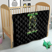 Black quilt blanket with diamond stitching and green skull graphic