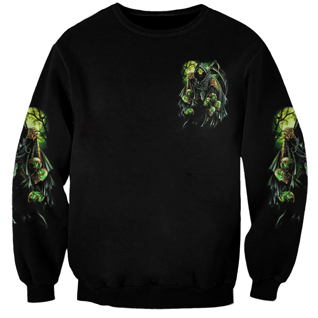 Unisex black skull sweatshirt with neon green graphic on chest and sleeves