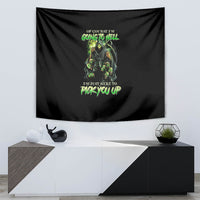 Black skull graphic tapestry with green neon figure and stylized text near center