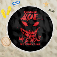 Black round beach blanket with red skull graphic, white fringe edge, 24/7 text