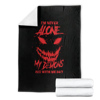 Black blanket with red skull graphic, folded and ready to use