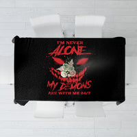 Black tablecloth with large red and white demon artwork and text graphic