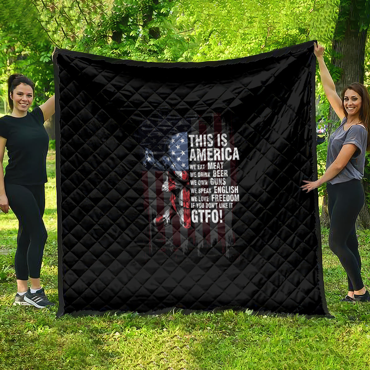 Black quilt with diamond stitching and patriotic skull graphic, 'THIS IS AMERICA' text