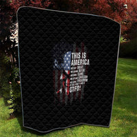 Black quilt with diamond stitching and patriotic skull graphic, draped on rounded-corner shape