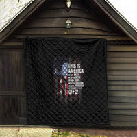 Black quilt with diamond quilting and patriotic skull print on an outdoor porch backdrop
