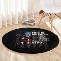 Black oval-shaped round rug with skull graphic and “THIS IS AMERICA” message
